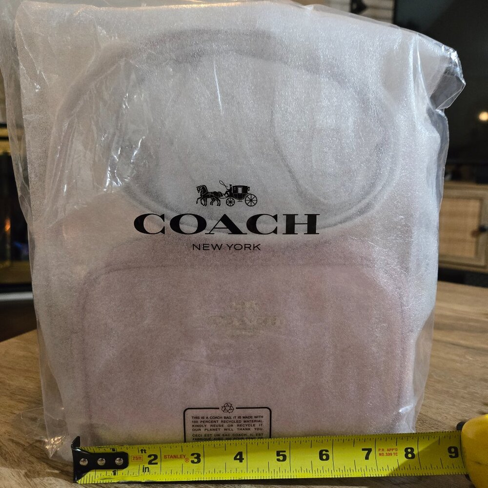 Coach Powder Pink Mini Jamie Camera Bag in Signature Canvas and Leather.